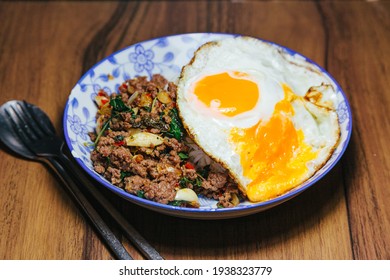 Pad Kra Pao Krapao Rice Thai traditional food with spicy basil and fried egg