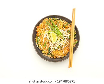 Pad Thai On A Dish And Chopsticks Placed On A White Background. Top View..