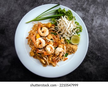 Pad Thai With Shrimp And Vegetables On A Dark Background, View From Above