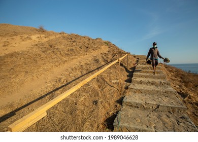 Padar Island- Komodo National Park , Indonesia. A Builder Is Working On A Hiking Trail On Padar Island To Make It Easier For Tourists To Reach The Top While Beautifying The Area,  Sept 4, 2017.