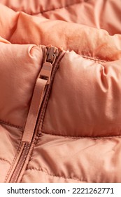 Padded Coat In Pinl Color With Zipper. Close Up Of Detail And Fabric Texture