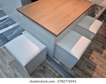 padded completely retracted under table top after meal. Space saving retracted, set compact cube space. Storage space stools removable seat hidden storage box. Modern look combination of natural wood decor on table top with white structure and light upholstery looks clean and timeless.