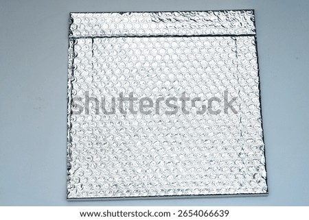 Padded envelope with bubble wrap isolated on white