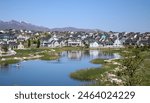 Paddle Boarders and Canoers Adventuring Through Oquirrh Lake in Daybreak South Jordan Utah 