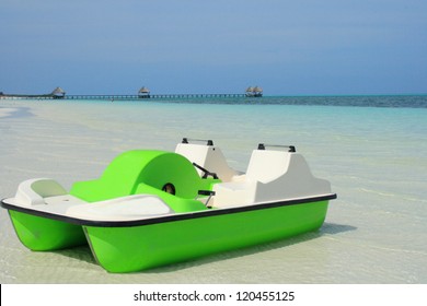 Paddle Boat On Beach By Ocean