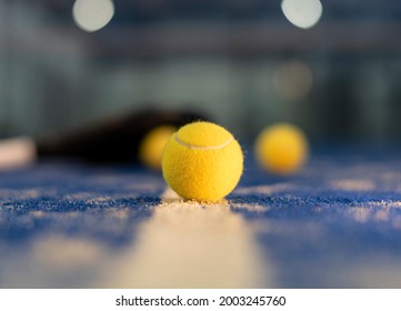 Paddle Tennis Ball On Blue Court