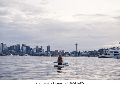 Paddleboarder on Calm Waters with Seattle Skyline - Powered by Shutterstock