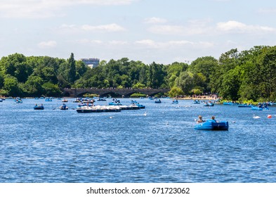 Paddling Boats On The Serpentine Lake At Hyde Park In Summer, London