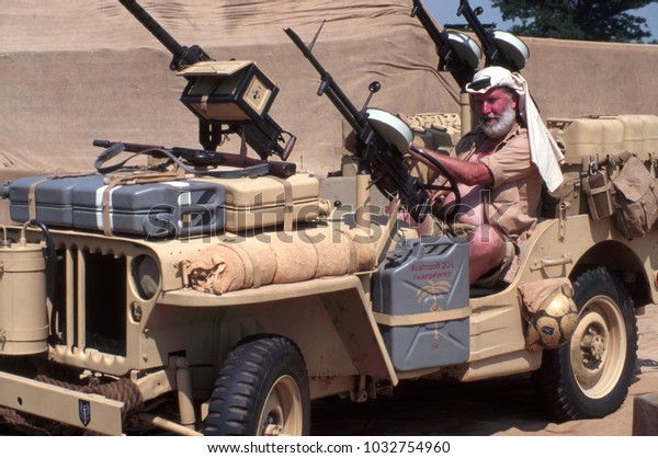 Paddock Wood Kent England 2003. An unidentified\
reenactor wears the uniform of a Special Air Services soldier and\
sits in a Jeep at a re-enactment of the Desert war in Africa 1943.\
Kent England.