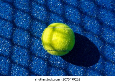 Padel Ball On A Blue Court