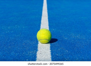 Padel Ball On A Blue Court