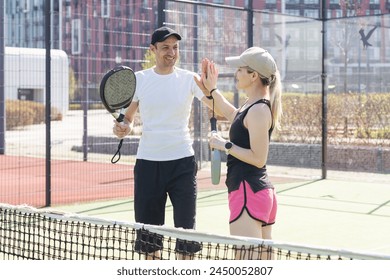 Padel lesson with a coach, personalized instruction in a supportive environment. - Powered by Shutterstock