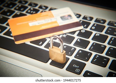 Padlock and credit cards on  computer keyboard. E-commerce data and ebanking protection, internet and finance security concept.