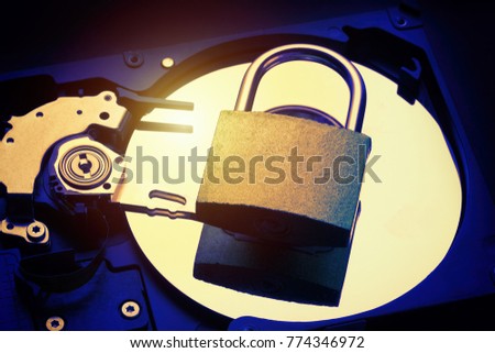 Padlock on computer hard disk drive HDD. Internet data privacy information security concept