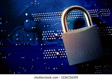 Padlock on computer motherboard. Internet data privacy information security concept. Antivirus and malware multilayer defense.