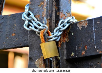 A Padlock On A Gate