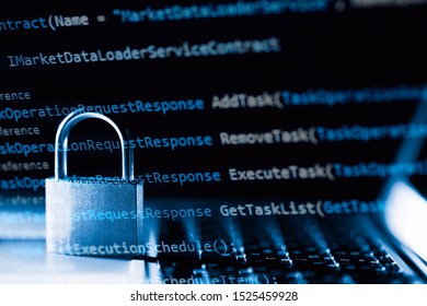 Padlock on laptop with a programming language. Internet data privacy information security concept. Antivirus and malware defense.