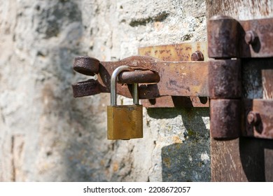 Padlock On An Old Rusted Metal Latch.