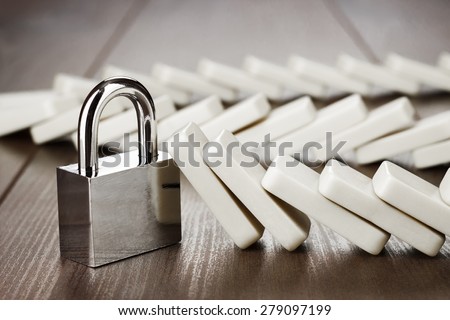 padlock standing still reliability concept on wooden table