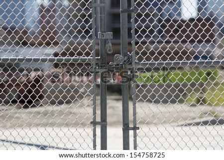 Padlocked gate at construction site