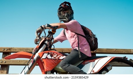 PADOVA, ITALY - Feb 04, 2019: A Rider Of An Orange KTM Motard Looking Back