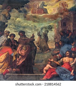 PADUA, ITALY - SEPTEMBER 9, 2014: Pain of scene as prophet Elijah  ascend to heaven in a chariot cf fire and Elisha with the his coat in church Basilica del Carmine from 17. cent by unknown painter.