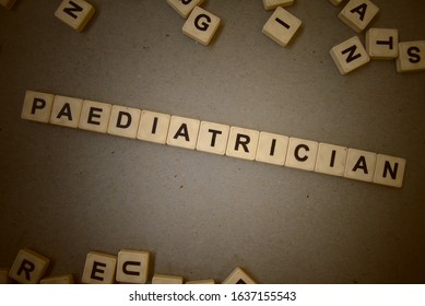 Paediatrician, Word Cube With Background.