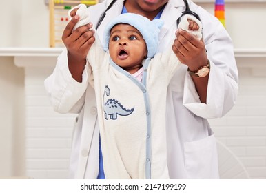 Paediatrics Is Her Passion. Shot Of A Little Baby At A Checkup With A Doctor At A Clinic.