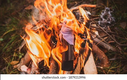 Pagan magic doll at fire, cleaner of negative and other rituals - Shutterstock ID 1879213996