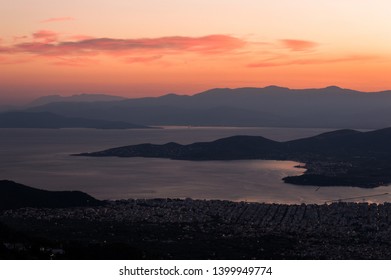 The Pagasetic Gulf In The Magnesia Regional Unit, Formed By Mount Pelion Peninsula.  Pictured Here Are Volos City And It's Port, During Sunset.