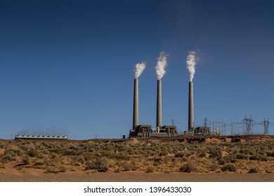 Page, Arizona, United States, November 2013: View On The Navajo Generating Station Coal Power Plant From A Distance, With Smoking Chimneys