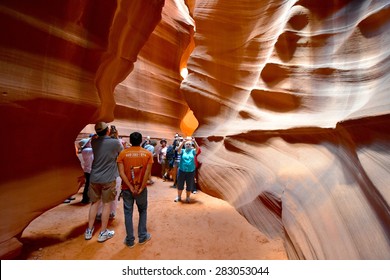 PAGE, AZ - MAY 26: Upper Antelope Canyon Tour On May 26, 2015 In Page AZ,USA. Thousands Of People From All Over The World Come To Visit Upper Antelope Canyon