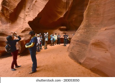 PAGE, AZ - MAY 26: Upper Antelope Canyon Tour On May 26, 2015 In Page AZ,USA. Thousands Of People From All Over The World Come To Visit Upper Antelope Canyon