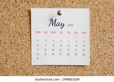 Page From The Calendar For The Full Month: May 2021. White Calendar Sheet Is Attached To Brown Cork Board. The Concept Of Calendar Date.