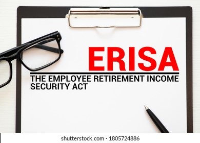 Page With ERISA The Employee Retirement Income Security Act Of 1974 On A Table.