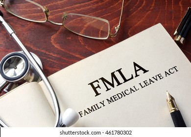 Page With FMLA Family Medical Leave Act On A Table.