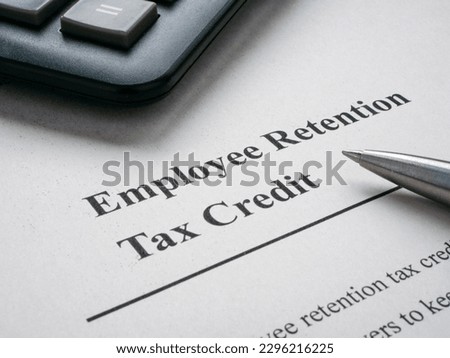Page with info about employee retention tax credit and pen.