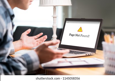 Page not found and error in laptop. Bad or slow internet connection. Frustrated man spreading hands in home office desk. Broken computer not working. Online information problem. Alert icon in website. - Shutterstock ID 1145058356