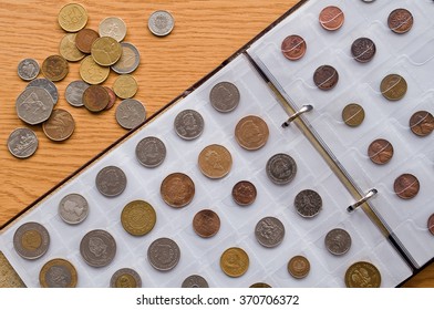 Page of numismatics album with different coins