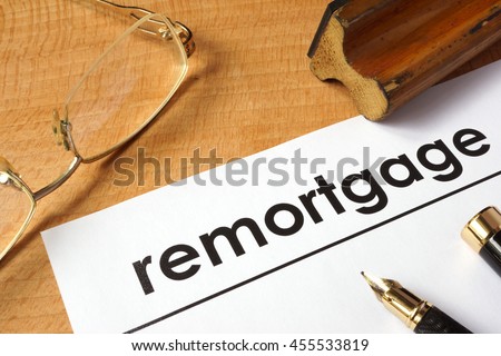 Page of paper with remortgage on a table.