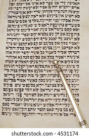 Page From A Torah Scroll With Silver Yad Pointer