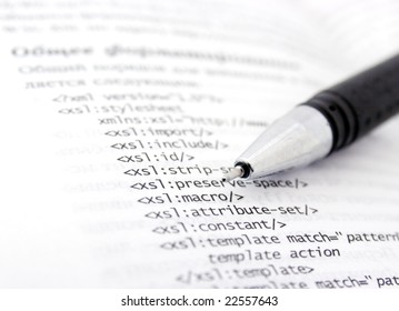 A Page Of Xml Code And Pen