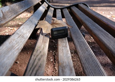 Pager, Old Vintage Beeper. The Pager Lies On A Park Bench