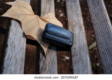 Pager, Old Vintage Beeper. The Pager Lies On A Park Bench