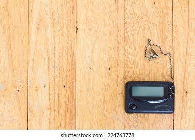 Pager On Wood Background