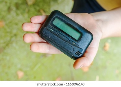 Pagers. Old Vintage Beeper. Pager In Hand