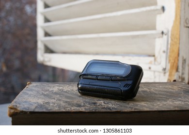 Pagers, Old Vintage Beeper. Pager On The Antique Book