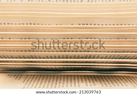 Similar – Close-up of many stacked songbooks with marking tapes in a church