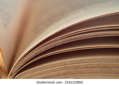 The pages of an old book captured when flipping are closed, leaving room for copying. Abstract An Open Old Book. Macrophotography of the sheets of an open old book. - Powered by Shutterstock