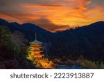 Pagoda of Seiganto-ji Temple at Nachi Katsuura with Nachi no Taki fall with waterfall and sunset in Wakayama, Japan